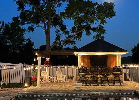 Night shot of 10' x 14' Siesta Poolside Bar in Patterson NY