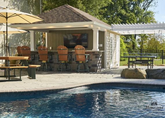 View from across the pool of 12' x 18' Siesta Poolside Bar with 12' x 12' Vinyl Pergola in Quakertown PA