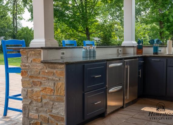 Outdoor Kitchen and Bar with Stone Veneer & Everlast Cabinets