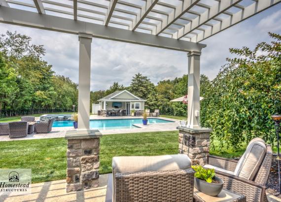Backyard view of 16' x 20' Wellington Pool House and 18' x 28' Somerset Attached PVC Pergola in Royersford PA
