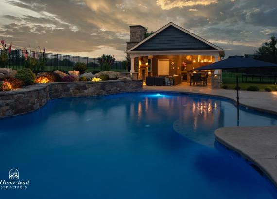Twilight shot of a 20' x 25' A-Frame Avalon Pool House with Outdoor Kitchen in Limerick, PA