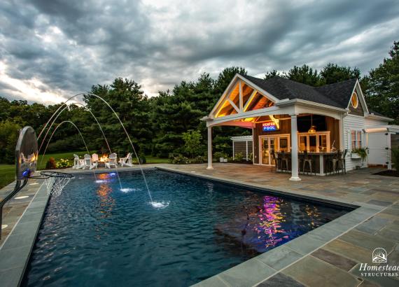 Twilight shot of Custom 20' x 40' Avalon Pool House with outdoor kitchen in Shenandoah Junction, WV