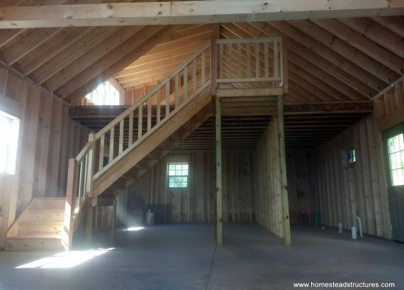 Interior of 22' x 44' custom Liberty 2-story shed with timber frame overhang