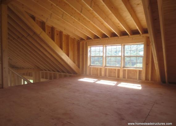 Interior dormer of 22' x 44' custom Liberty 2-story shed with timber frame overhang in NY