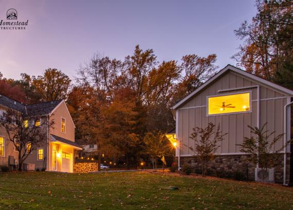 Twilight photo from the side of  21' x 43' 3-Car Garage in Wayne PA with 2nd floor Gym & Living Space