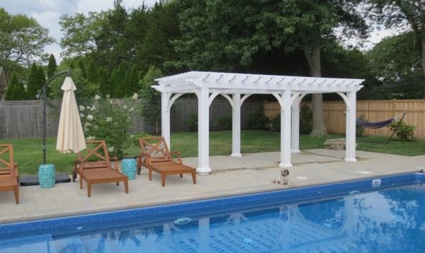 10 x 18 white vinyl pergola by Homestead Structures next to pool