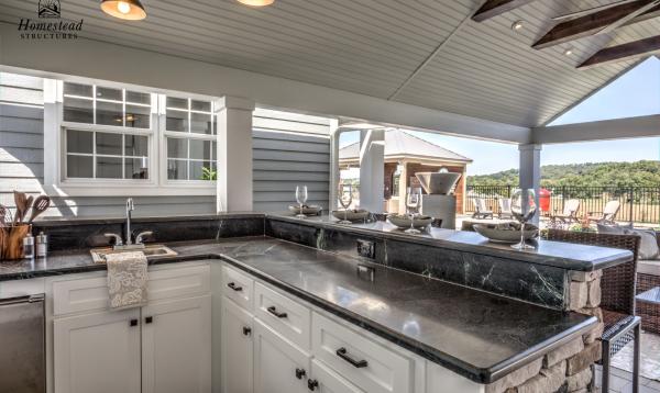 Custom Outdoor Kitchen under an Avalon Pool House