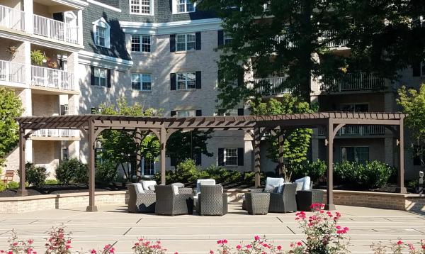 Radius pergola contructed via commercial building & design services by Homestead Structures
