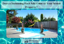 Potted plants adorn a swimming pool with a slide in a fenced-in backyard.