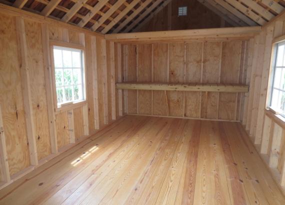 Interior of 1 Car garage with work bench and loft