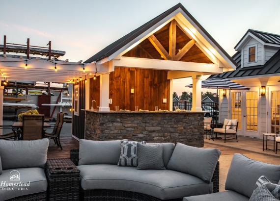 Twilight shot of 10' x 14' A-Frame Siesta Poolside Bar with attached Pergola in New Holland PA