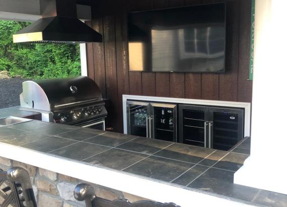 Bar area with grill and built in fridge of 10' x 14' Siesta Poolside Bar in Andover NJ