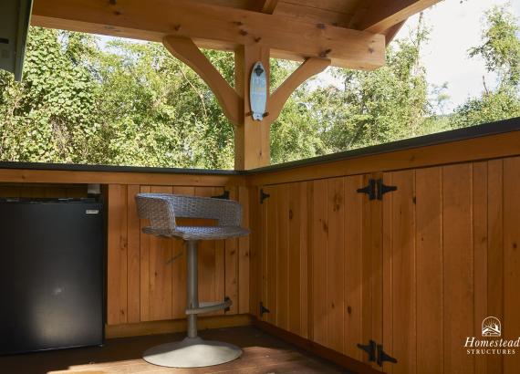 Bar cabinets and mini fridge on the 12' x 14' Timber Frame Siesta Poolside Bar with TV in Carlisle PA