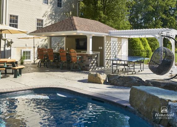 View from across the pool of 12' x 18' Siesta Poolside Bar with 12' x 12' Vinyl Pergola in Quakertown PA