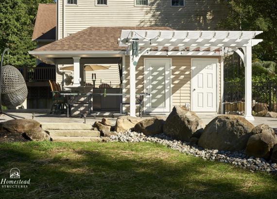 View of 12'x12' Vinyl Pergola attached to Siesta Pool House