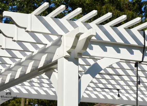 Pergola detail of 12'x12' Vinyl Pergola with swings attached to Siesta Pool House