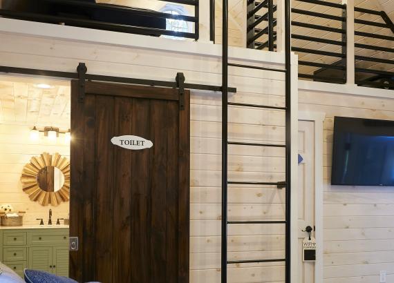 Bathroom with Sliding Barn Door in 16x24 Custom Liberty Pool House