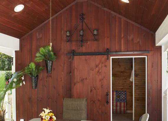 Stained siding of custom double-ended Avalon pool house