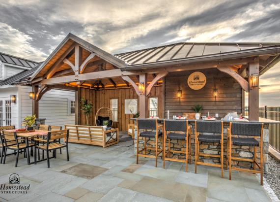 Twilight shot of 14' x 28' Custom Timber Frame Avalon Pool House with metal roof in New Holland PA