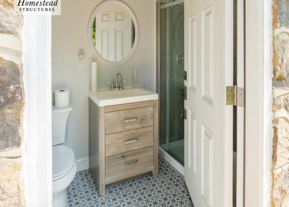 Bathroom photo of 16' x 28' Custom Avalon Pool House with Reverse Gable in Huntingdon Valley, PA