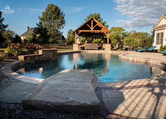 Poolside 16' x 14' Timber Frame Pavilion in PA with fireplace