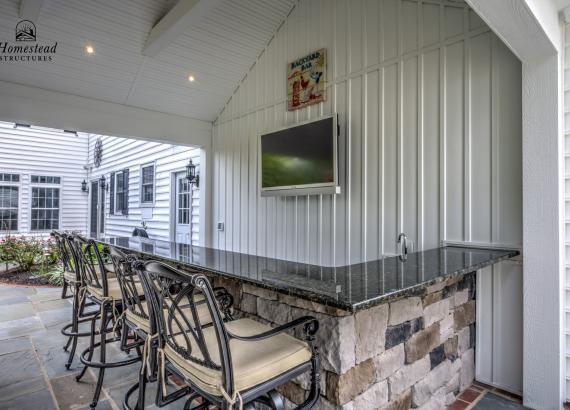 Bar counter under a 16' x 22' Attached A-Frame Vintage Pavilion with Fireplace & Outdoor Kitchen in Doylestown PA