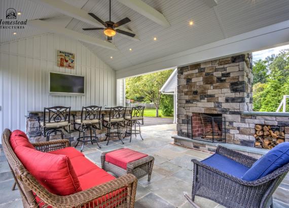 Under the pavilion of 16' x 22' Attached A-Frame Vintage Pavilion with Fireplace & Outdoor Kitchen in Doylestown PA