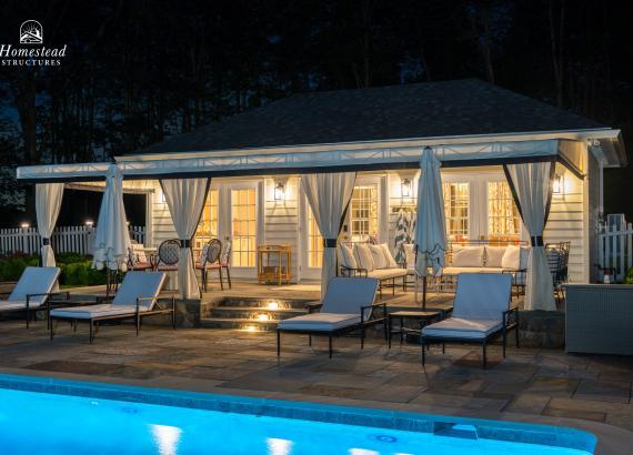 16' x 30' Luxury Hip Roof Pool House in Greenwich, CT Lit Up at Night