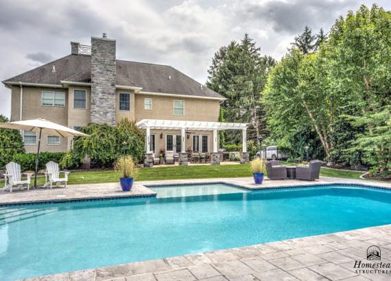 Across the pool view of 18' x 28' Somerset Attached PVC Pergola in Royersford PA