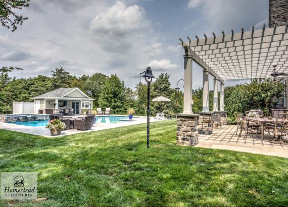 Backyard view of 16' x 20' Wellington Pool House and 18' x 28' Somerset Attached PVC Pergola in Royersford PA