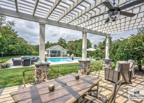 Backyard view of 16' x 20' Wellington Pool House and 18' x 28' Somerset Attached PVC Pergola in Royersford PA