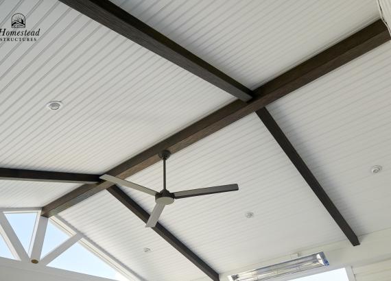 Vinyl beaded ceiling with Etchwood beams in 18x17 attached a-frame pavilion in Royersford, PA