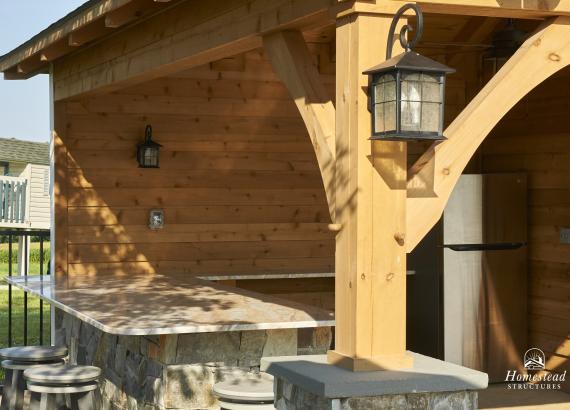 Stone bar counter from a 18' x 22 Custom Avalon with Timberframe Rafters in Woodbine, MD