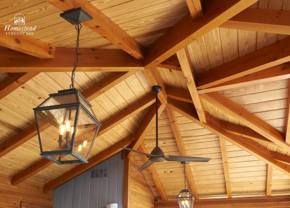 Timberframe detail and lighting of 18' x 22' Timber Frame Avalon Pool House in Wayne PA