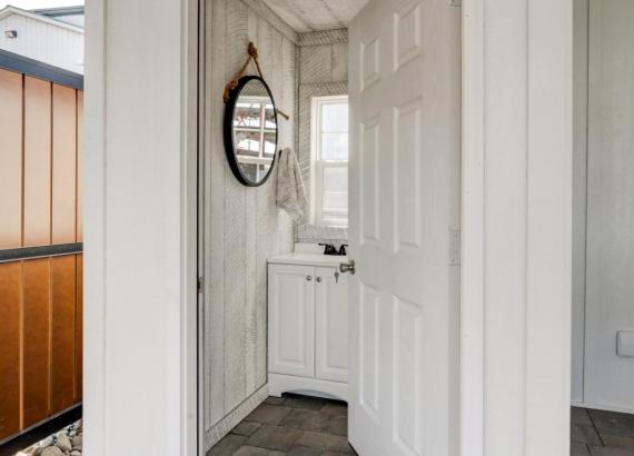 Bathroom of 18' x 24' A-Frame Avalon Pool House with open Maple Leaf gable in Homestead Structures Outdoor Showroom