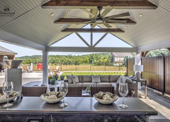 18' x 24' A-Frame Avalon Pool House with open Maple Leaf gable in Homestead Structures Outdoor Showroom