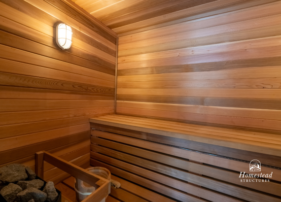 Warm and inviting interior of a custom-built cedar sauna with ambient lighting and comfortable seating, offering ultimate relaxation