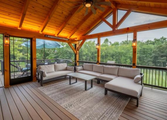 Lounge area of Attached 20' x 20' Timber Frame Pavilion with Timbertech Deck in Royersford