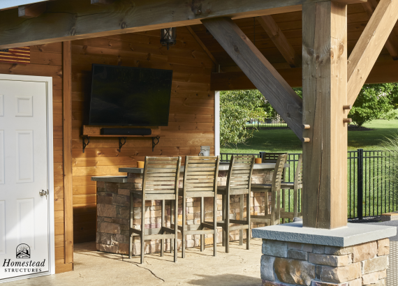 Under the pavilion of a rustic Timberframe 20x20 Avalon in Emmaus PA