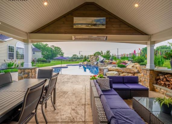 Under the pavilion of a 20' x 25' A-Frame Avalon Pool House with Outdoor Kitchen in Limerick, PA