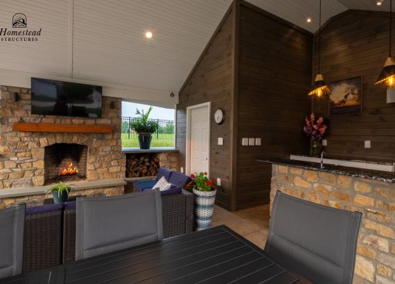 Under the pavilion of a 20' x 25' A-Frame Avalon Pool House with Outdoor Kitchen in Limerick, PA