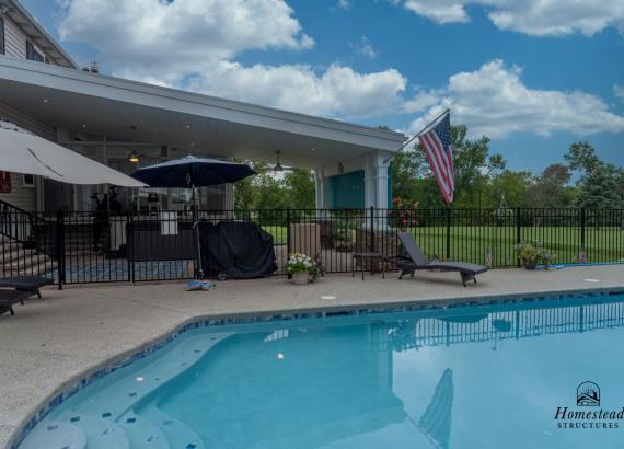 Poolside photo of a 20' x 30' Attached Patio Pavilion with Privacy Screen in Collegeville PA