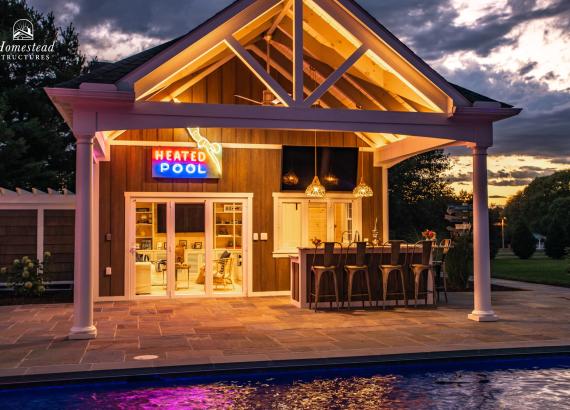 Twilight shot of Custom 20' x 40' Avalon Pool House with outdoor kitchen in Shenandoah Junction, WV