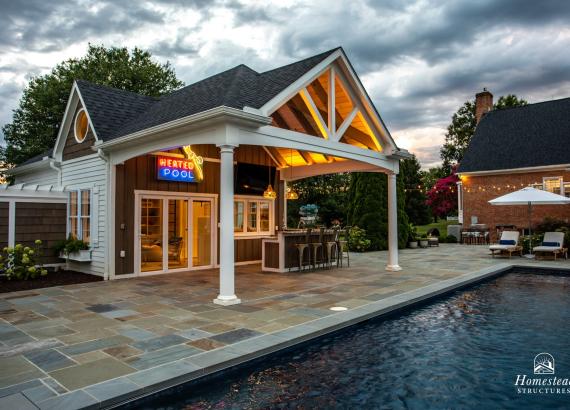 Twilight shot of Custom 20' x 40' Avalon Pool House with outdoor kitchen in Shenandoah Junction, WV