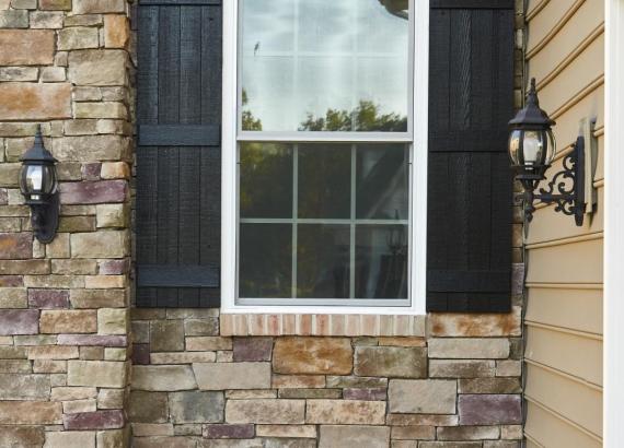 Windows and porch lights of custom built attached garage in Maryland