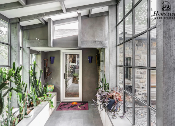 Plant room attached to the garage, connecting it seamlessly with the main house, featuring organized storage and functional design