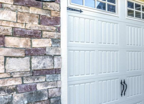 Close up shot of garage doors and stone facade on a 28' x 22' Classic 2-Car Attached Garage in Clarkesville MD