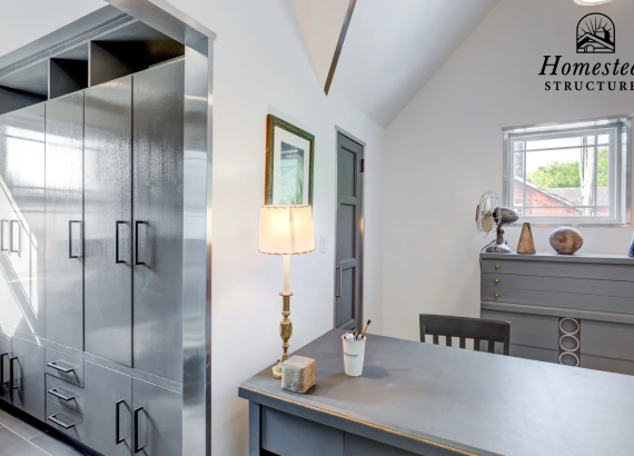 Alternate angle view of additional space near the office in a custom two-story garage, showcasing efficient use of space and design