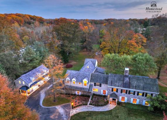 Aerial twilight photo of 21' x 43' 3-Car Garage in Wayne PA with gym and living space