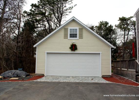 2 story 2-car garage with vinyl siding